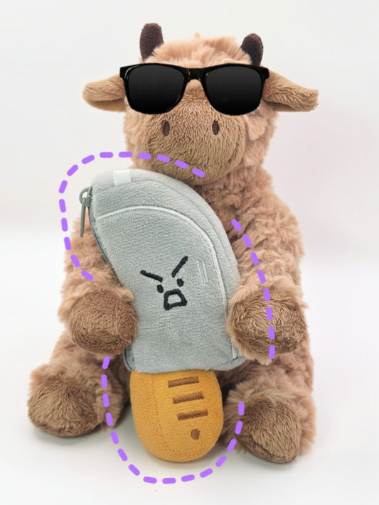 Plush toy cow with sunglasses and a gray shell on a white background