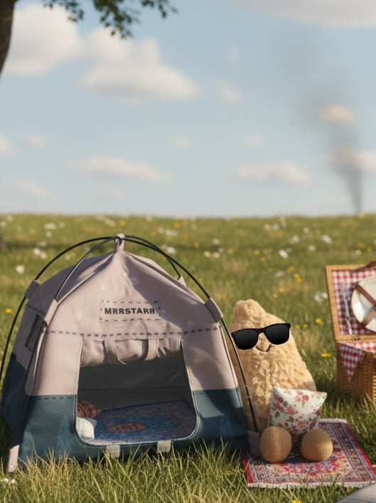 Small tent with a peanut wearing sunglasses on a grassy field