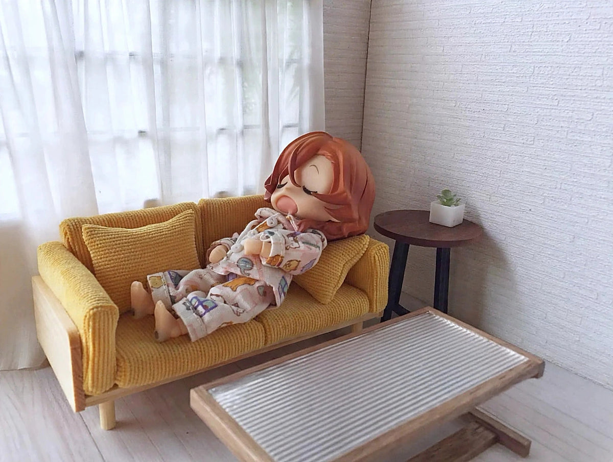 Ginger yellow 1:12 scale doll sofa with cotton doll, no text overlay